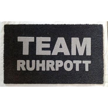 pad LIFESTYLE Fußmatte – 60% Polyvinylchlorid / 40% Kokos, maritimes Anker-Design mit großem Schriftzug, leicht zu reinigen. Team Ruhrpott - Bild-Darstellung des Produktes 1